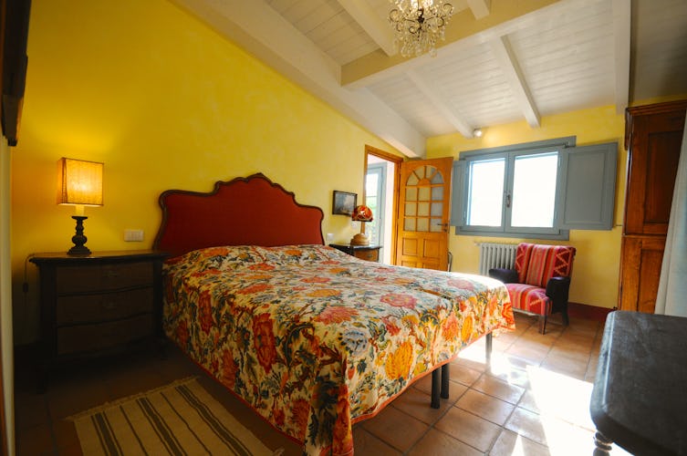 One of the two bedrooms in this charming Chianti apartment