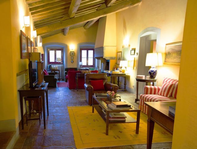 Classical Tuscan architecture with large fireplace & terracotta floors