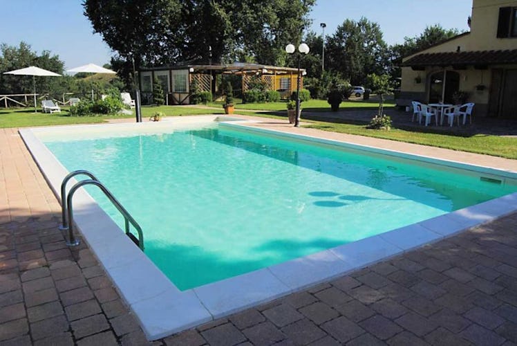 Enjoy time pool side with the table & chairs  provided