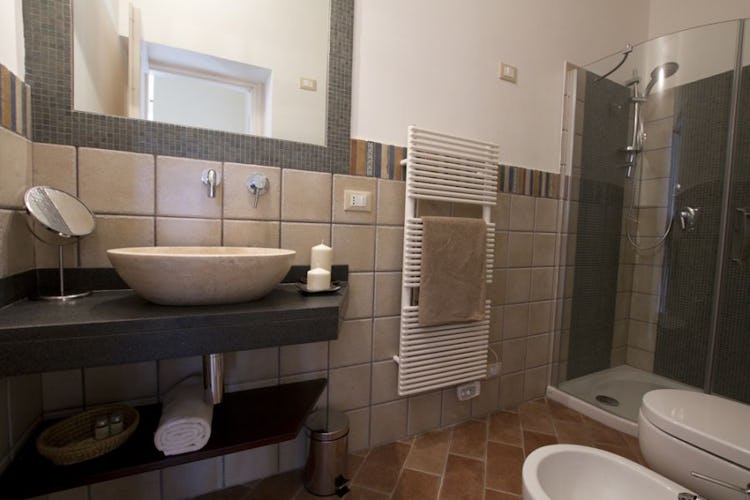 Bathrooms are all modernly and stylishly furnished