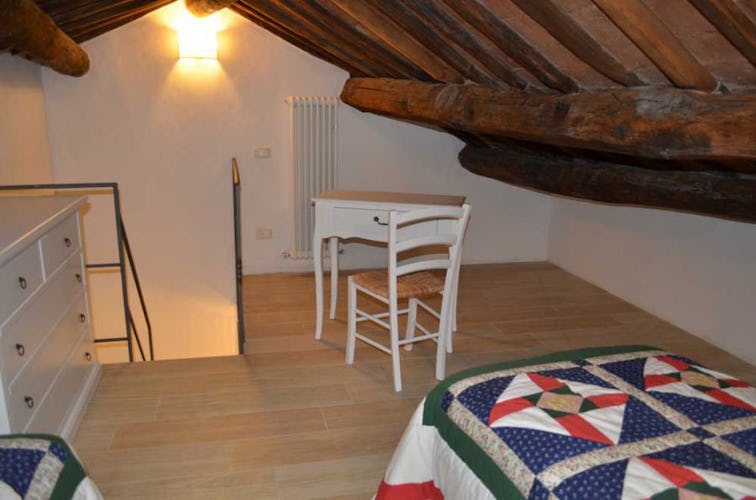 The holiday apartment was restored to maintain the wood beam ceilings
