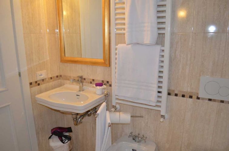 The bathrooms are supplied with towel warmers and hairdryers