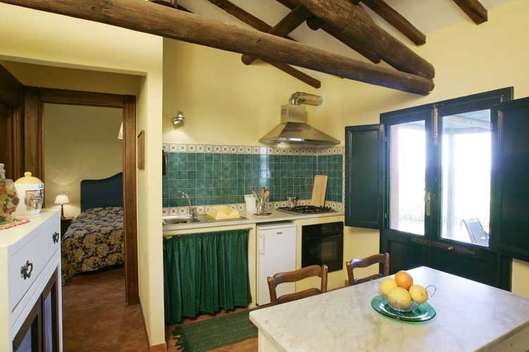 A warm environment with wood beam accents and access to gardens