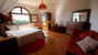 Arched windows and Tuscan stone accents at Le Selvole