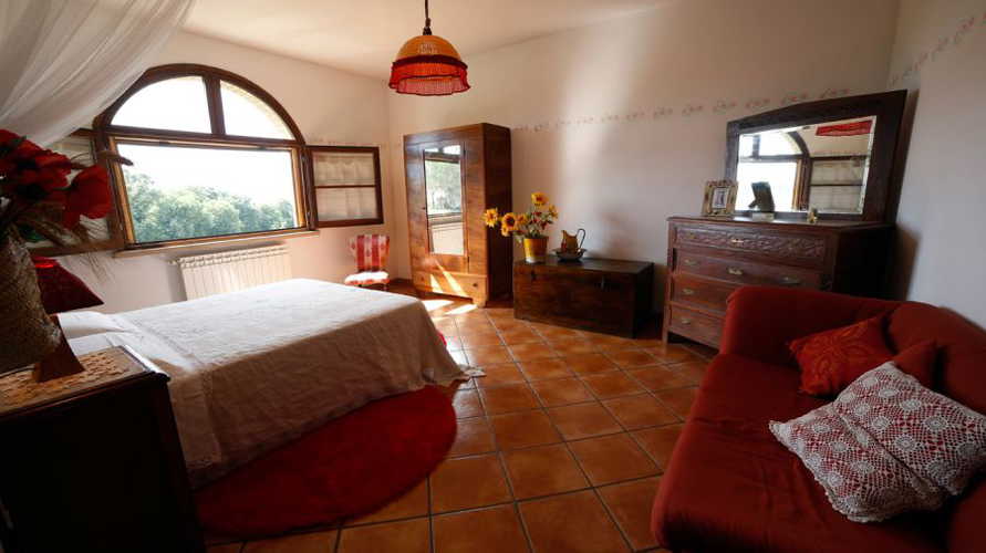 Arched windows and Tuscan stone accents at Le Selvole