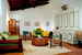 Spacious rooms with terracotta floors and wood beam ceilings