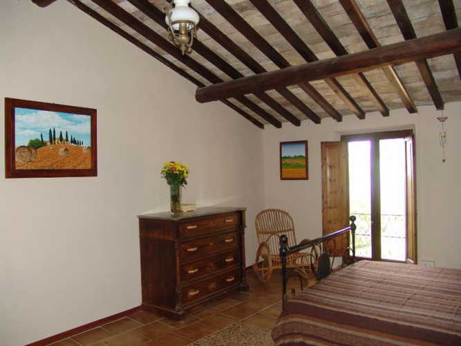 Bedroom with view on the green rolling hills