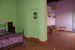 A wide coloured room of the farmhouse