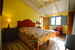 One of the two bedrooms in this charming Chianti apartment