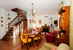Full dining room and living room with fireplace, family environment