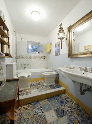 A bathroom with a full sized tub at Candida's Chianti House