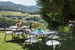 The pool is surrounded by a well maintained garden area