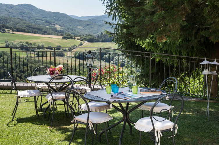 The pool is surrounded by a well maintained garden area