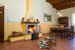 Warm and inviting with a cozy fireplace and wood beam cielings