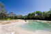 The stone outdoor pool surrounded by the green park