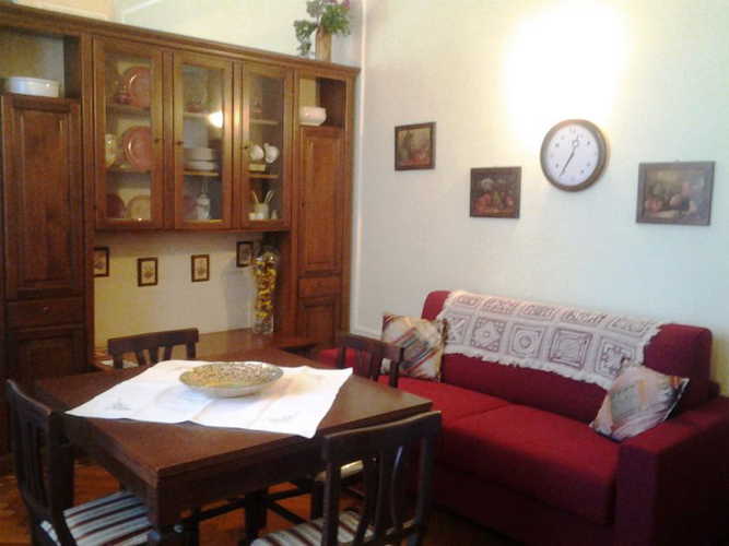 The living room with table, chairs & sofa bed