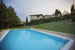 One of the outdoor pool in front of the stone house