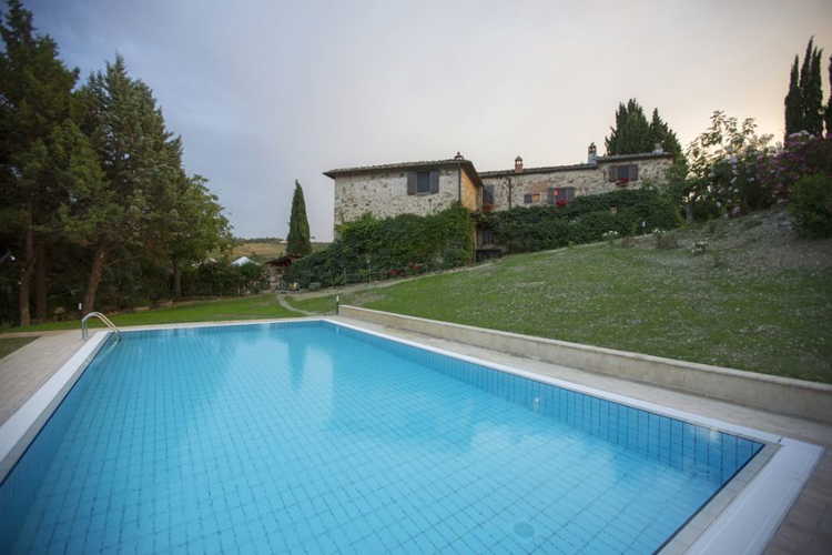 One of the outdoor pool in front of the stone house