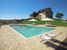 Poderi Firenze - Poolside View of Farmhouse