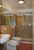 The living room of the Attico apartment with wooden beam ceiling