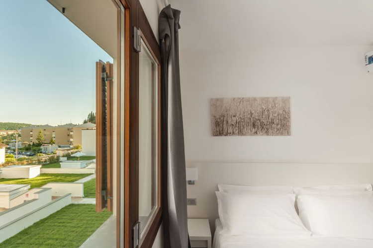 Practically in the city center of Pelago, a refreshing pool and garden