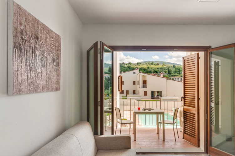 Relax on your private balcony at The Florence Hills Luxury Resort