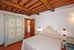 Handpainted furniture and lumiunous bedrooms at Villa Montegufoni