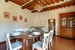 Enjoy meals together in the dining room with fireplace at Villa Stolli