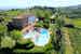 View of Borgo La Casaccia from above, with its gardens and two pools