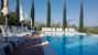 Refreshing pool surrounded by typical Tuscan Cypress trees