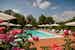 Ample chairs and umbrellas at the pool of Santa Maria