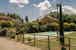 Villa Borgo la Fungaia: la piscina, recintata e circondata da un grazioso giardino
